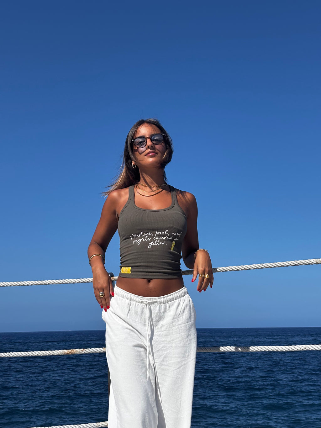 "Martini, pool, and regrets covered in glitter."